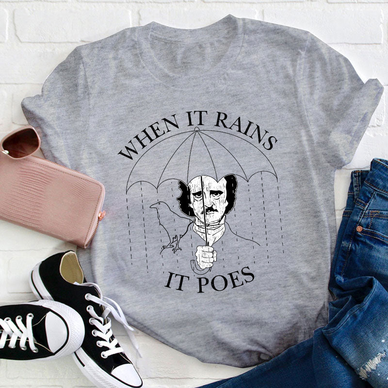 When It Rains It Poes Teacher T-Shirt