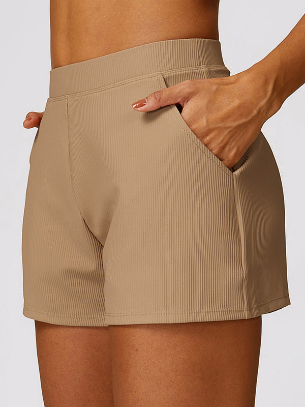 Wrap Pockets Solid Color Sports Shorts